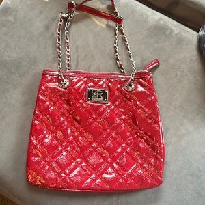 Kenneth Cole reaction, red bag